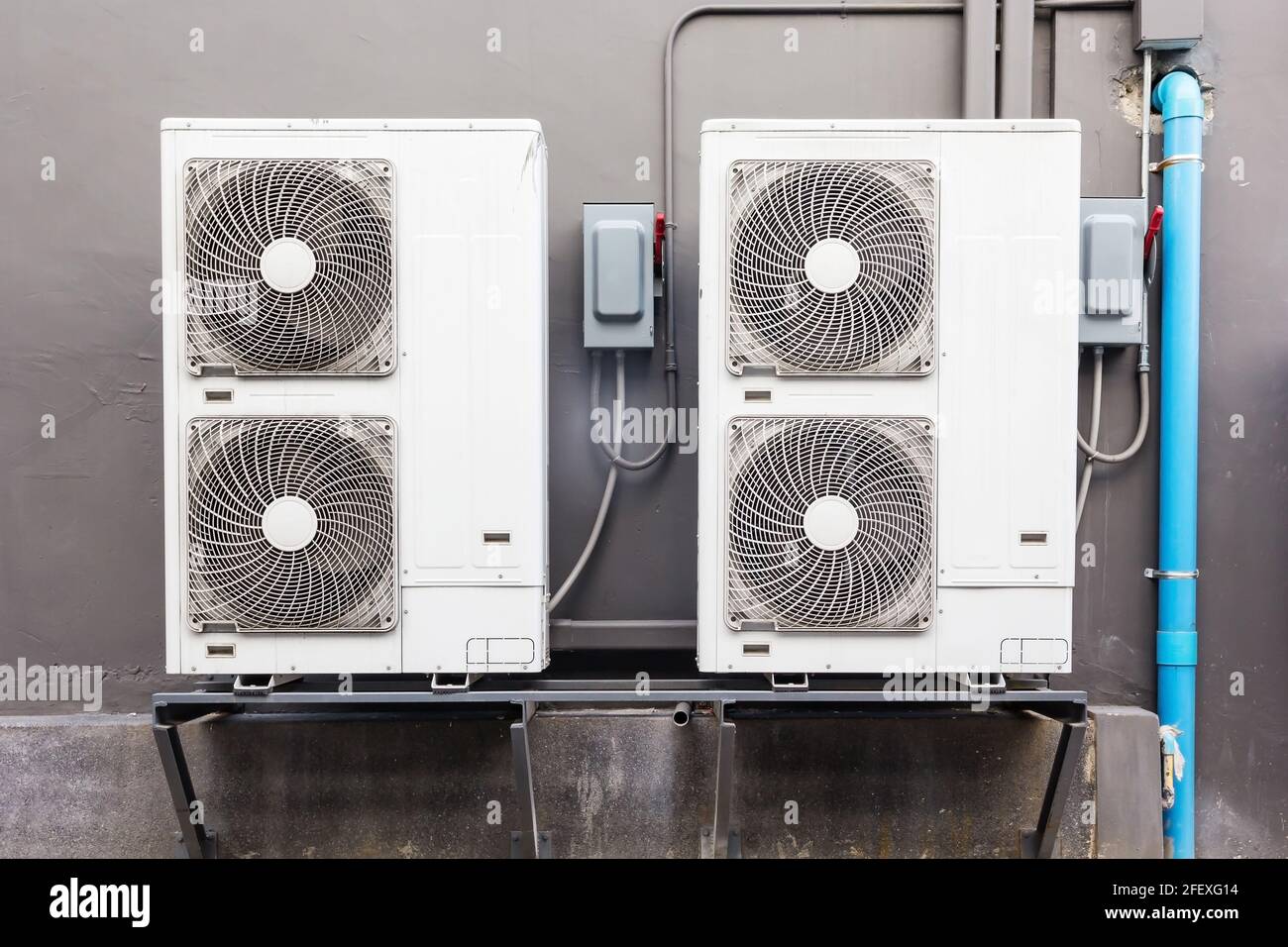 Many external Air compressors units installed outside of the building