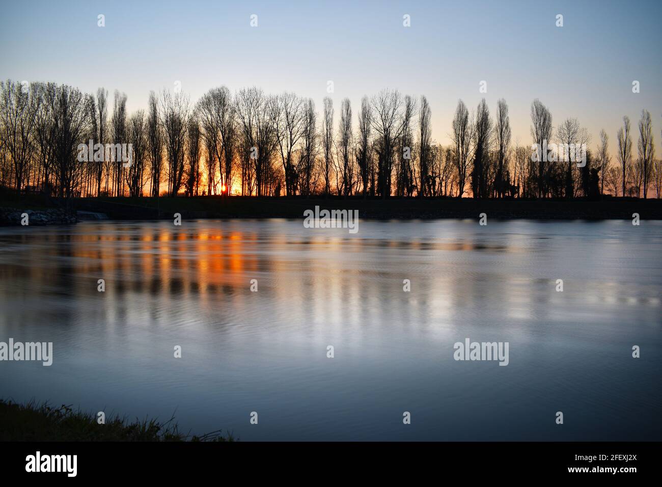 amazing sunset on the Muzza river Stock Photo - Alamy