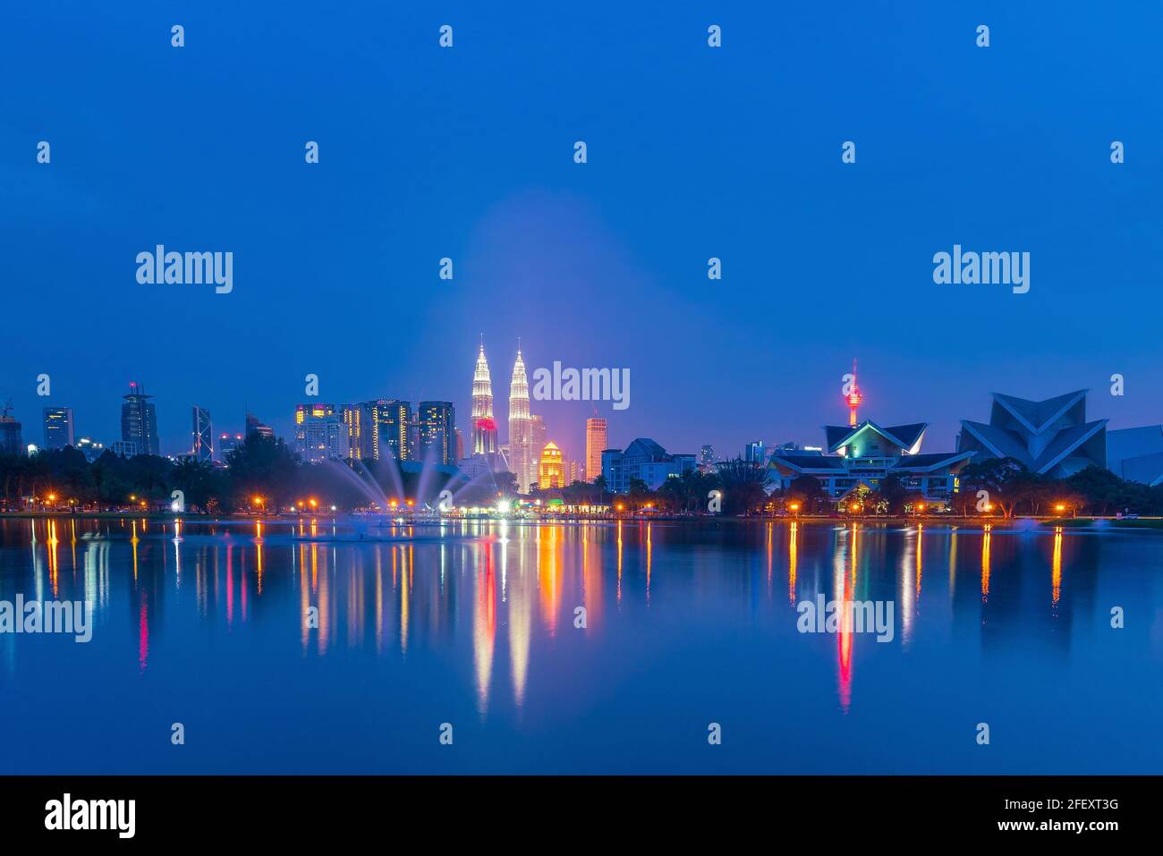 Night view of Kuala Lumpur city skyline with reflection in water Stock ...