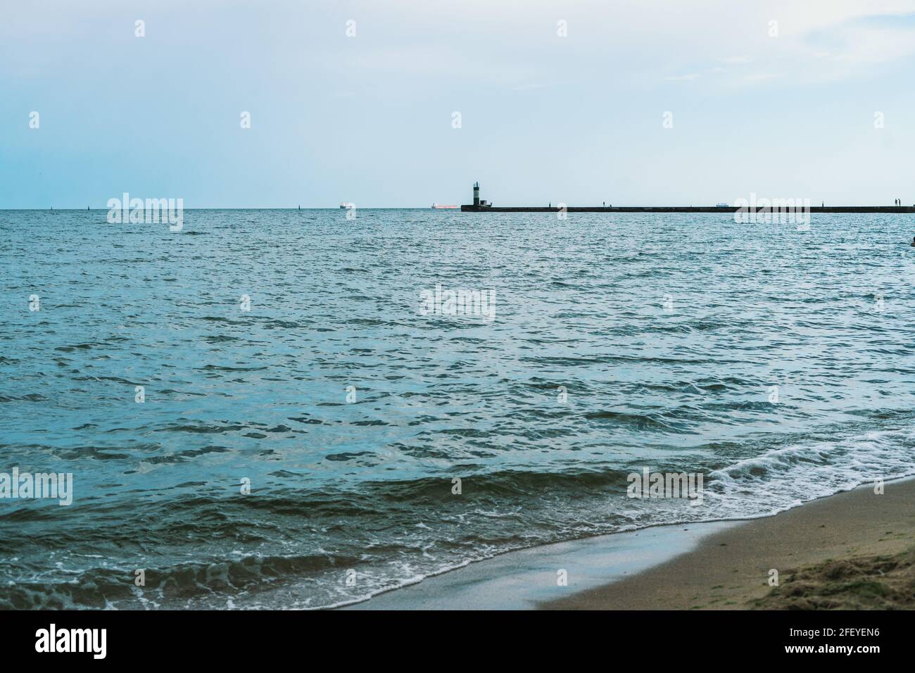 Sea waves at Odessa beach with lighthouse on background Stock Photo - Alamy