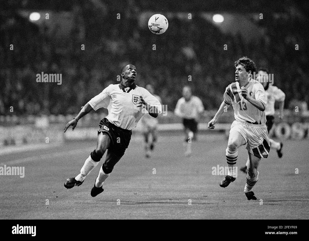 England v Romania playing an international friendly 12th October 1994 at Wembley. Englands Ian Wright comes away with the ball after Romania Tibor Selymes trys to obtain possessionThis image is bound by Dataco restrictions on how it can be used. EDITORIAL USE ONLY No use with unauthorised audio, video, data, fixture lists, club/league logos or “live” services. Online in-match use limited to 120 images, no video emulation. No use in betting, games or single club/league/player publications Stock Photo