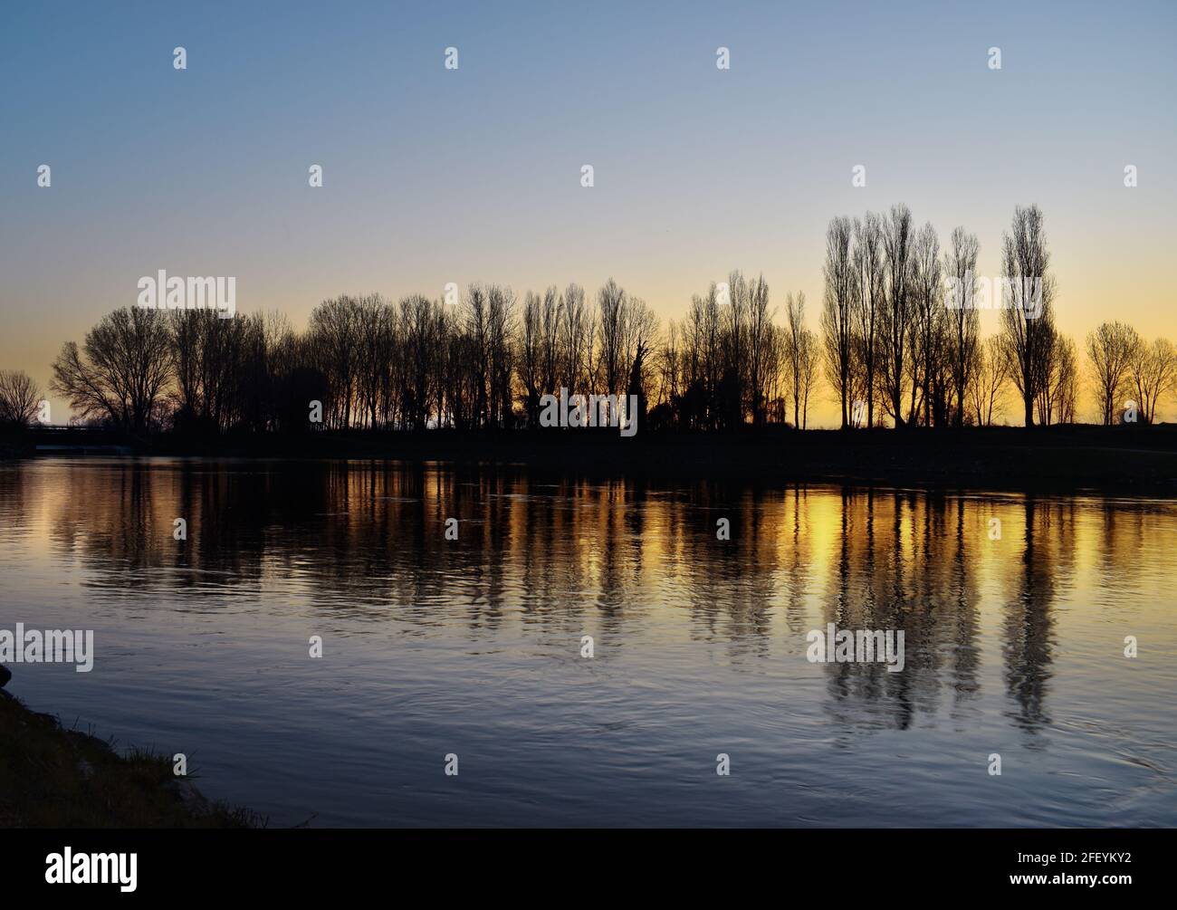 amazing sunset on the Muzza river Stock Photo - Alamy