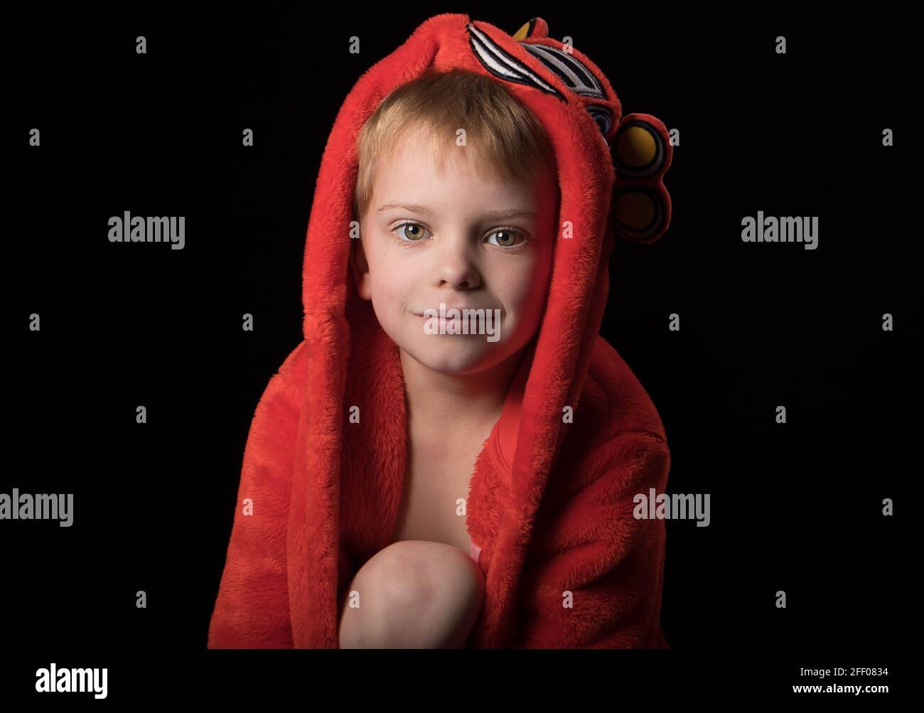 Young boy poses for the camera beforeDreamy pose bed Stock Photo Alamy