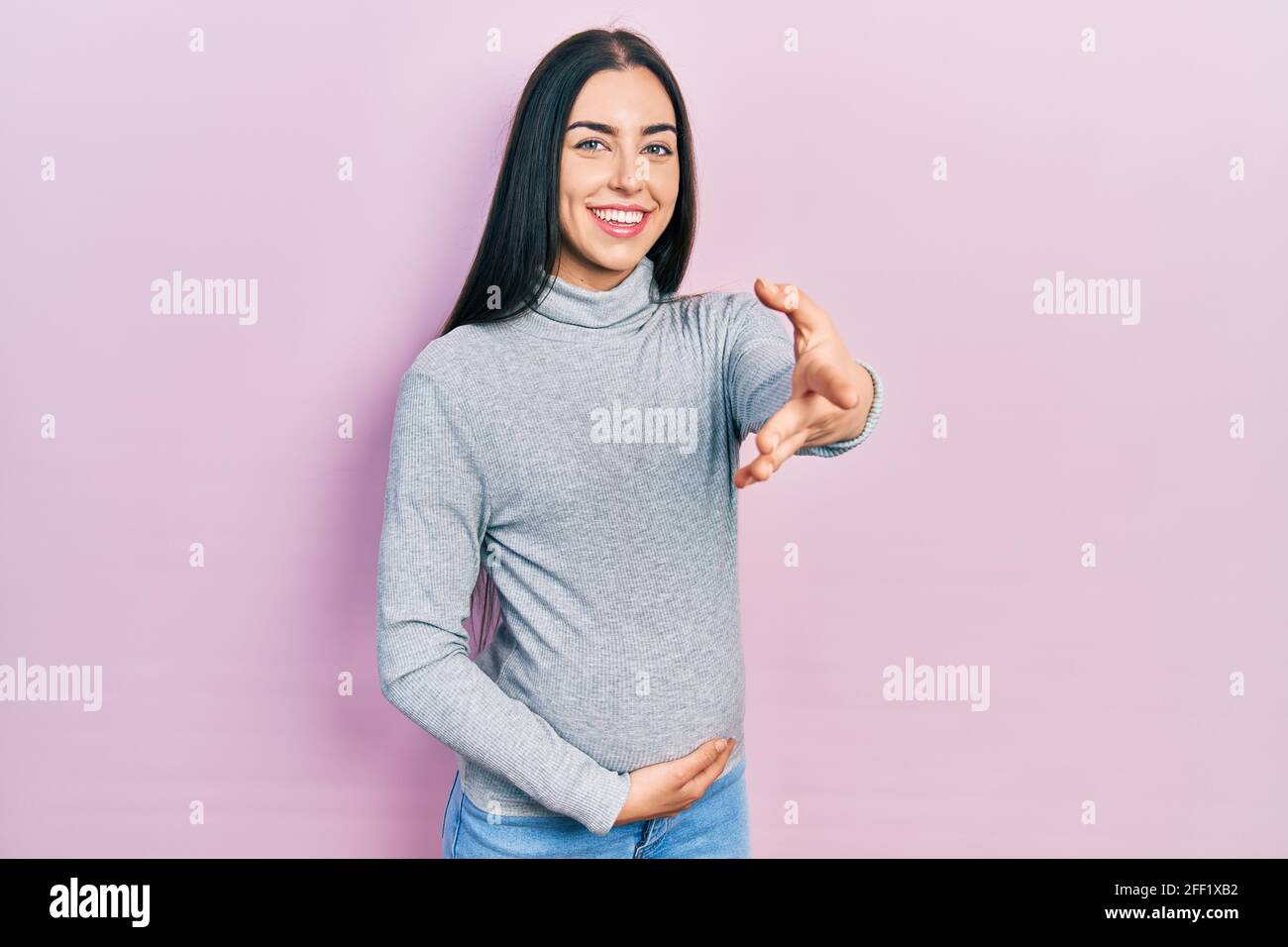 Beautiful woman with blue eyes expecting a baby, touching pregnant ...