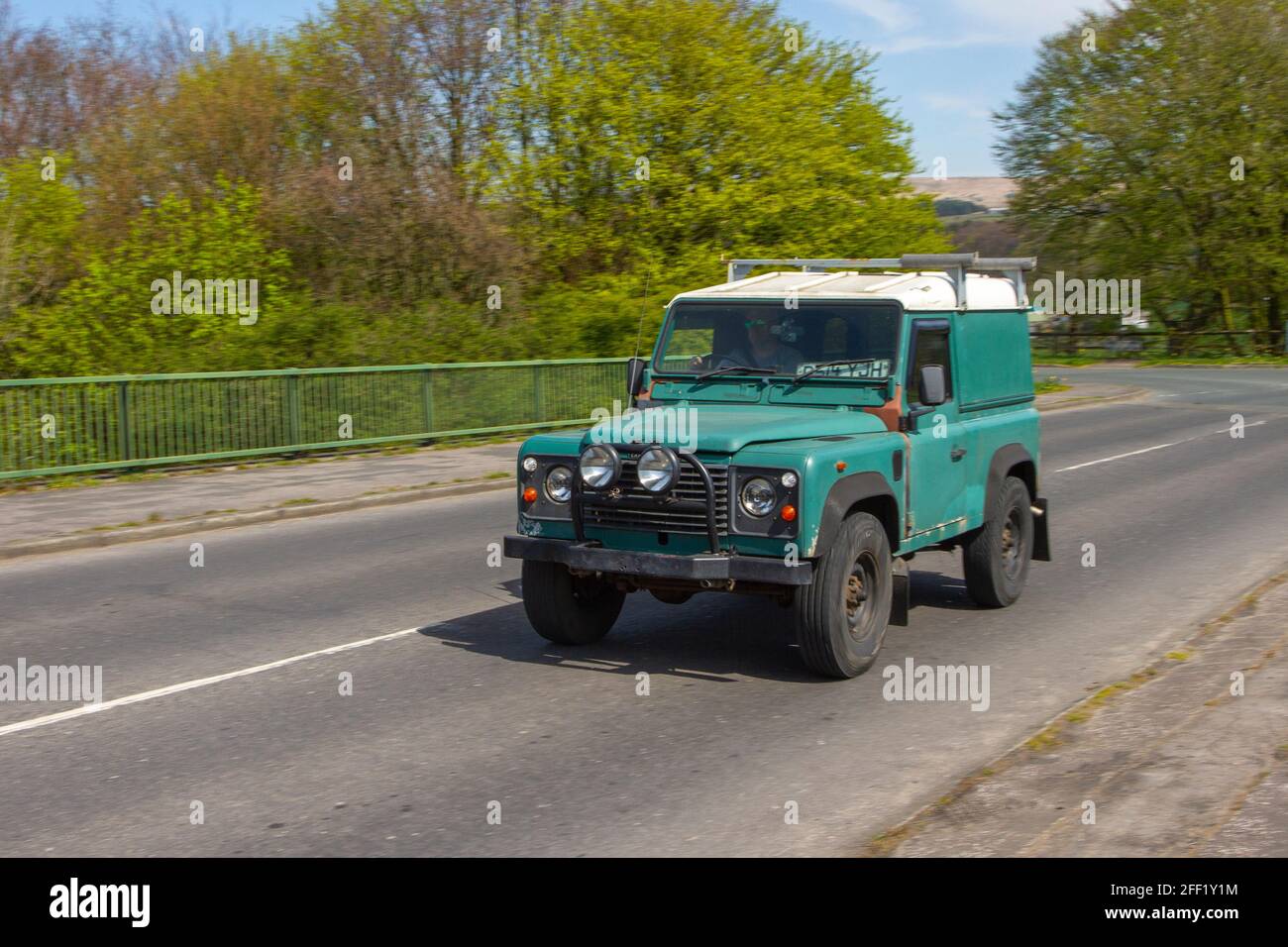 1987 80s green Land Rover 90 Reg Dt diesel; moving vehicles, cars, vehicle driving on UK roads, LCV motors, motoring on the M6 English motorway road network Stock Photo