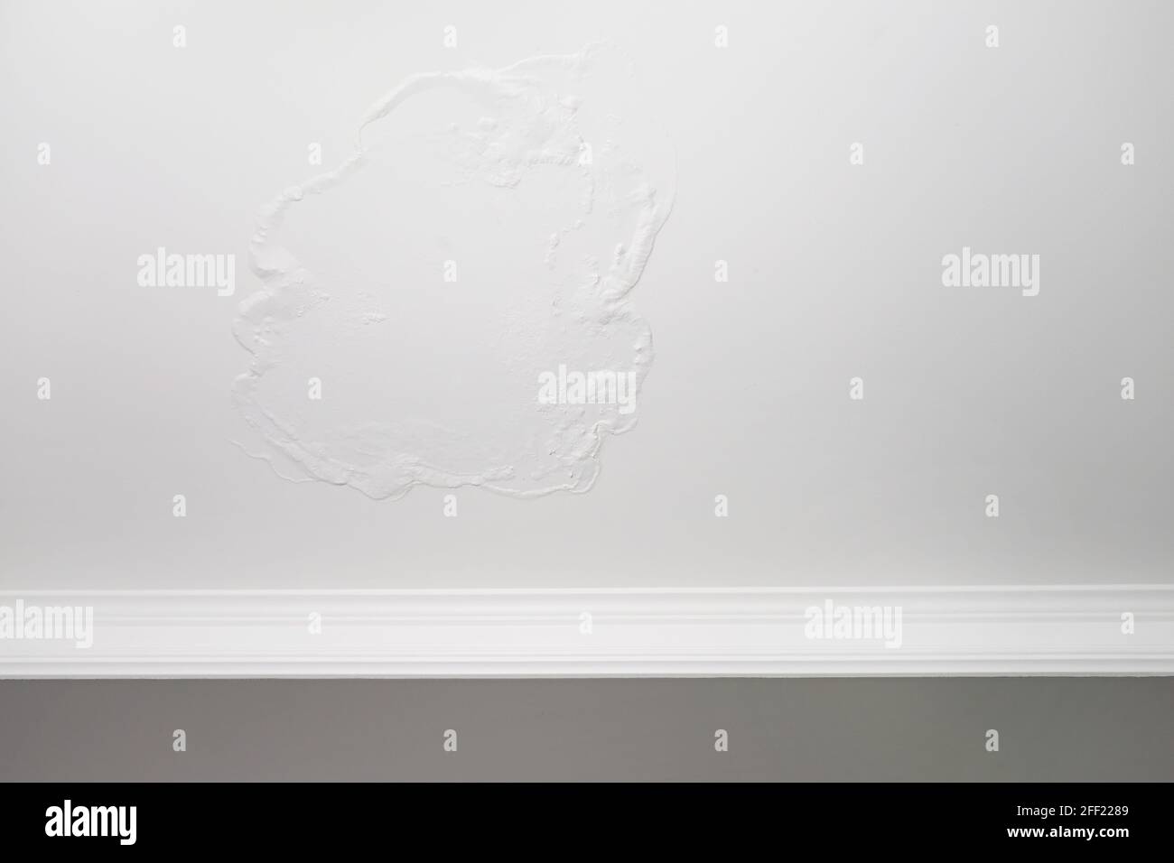 Large spots and cracks on the bathroom ceiling after flooding Stock Photo Alamy