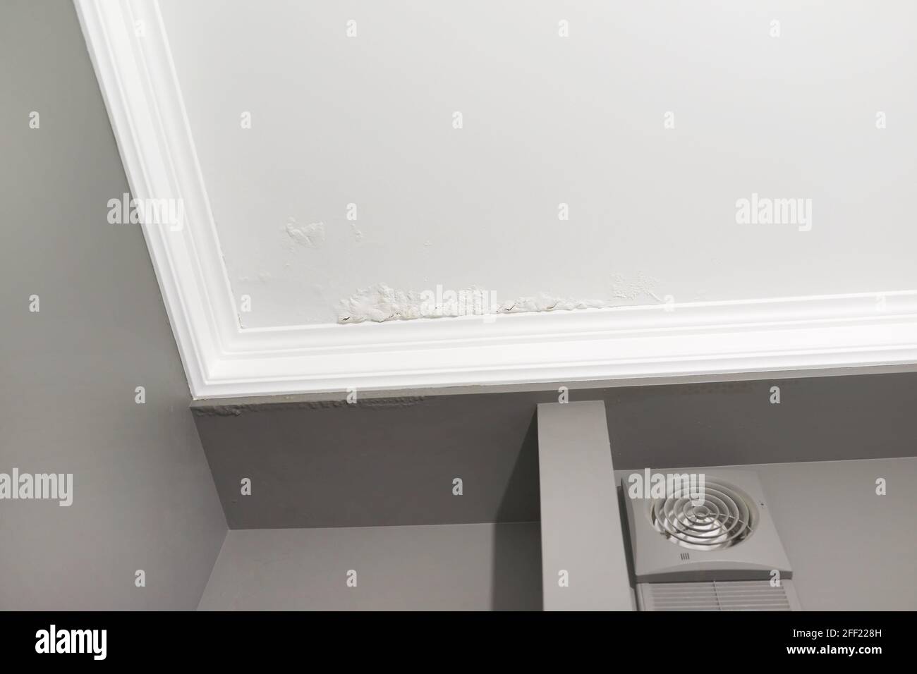 Large spots and cracks on the bathroom ceiling after flooding Stock Photo Alamy