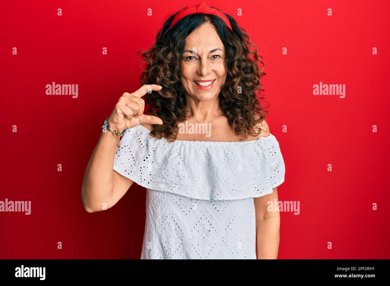 Middle age hispanic woman wearing casual clothes smiling and confident ...