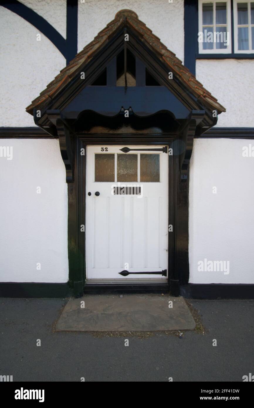 Vintage English white front door on Tudor style heritage building Stock Photo