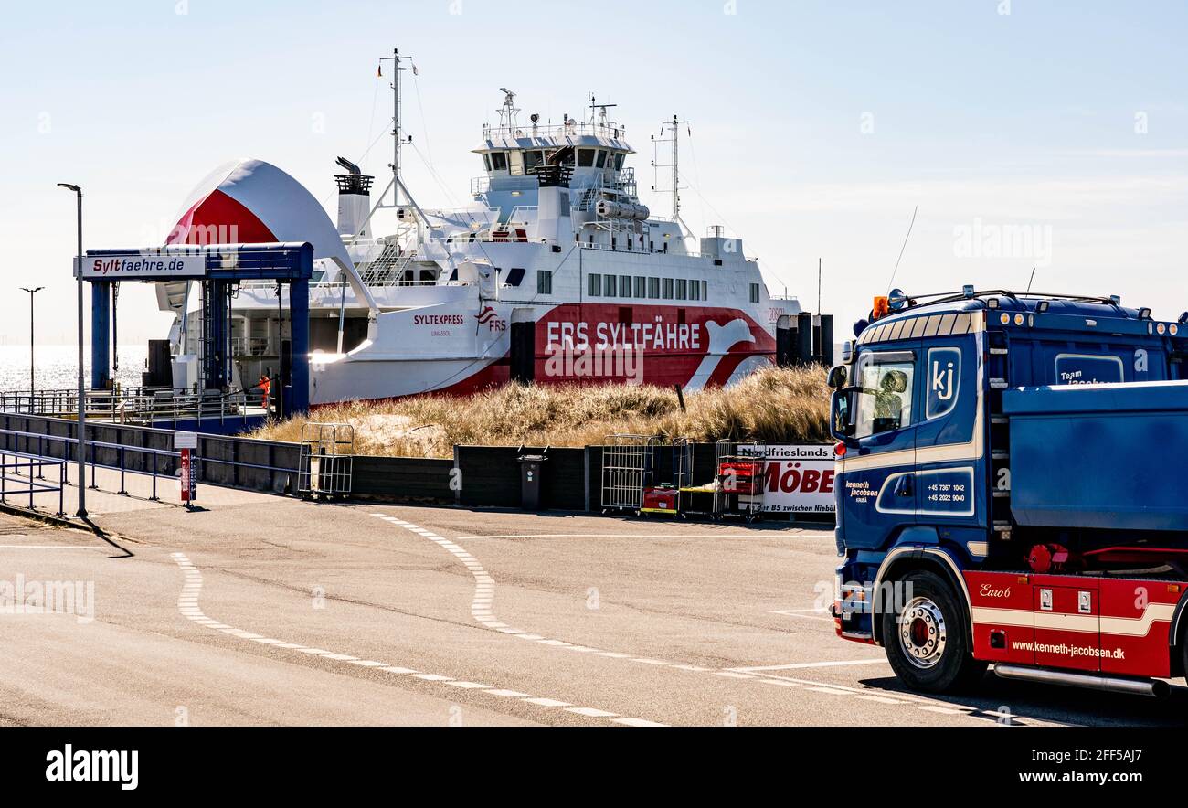 List Auf Sylt, Germany. 24th Apr, 2021. A truck drives to the island of Sylt in the harbour on the Sylt ferry. The municipality of Sylt will participate in the North Frisia Tourism Model Project. In four model regions in Schleswig-Holstein, tourism businesses are to test a gradual relaxation of corona protection measures. The model project on Sylt starts on 1 May and is initially scheduled to run until 31 May. Credit: Axel Heimken/dpa/Alamy Live News Stock Photo