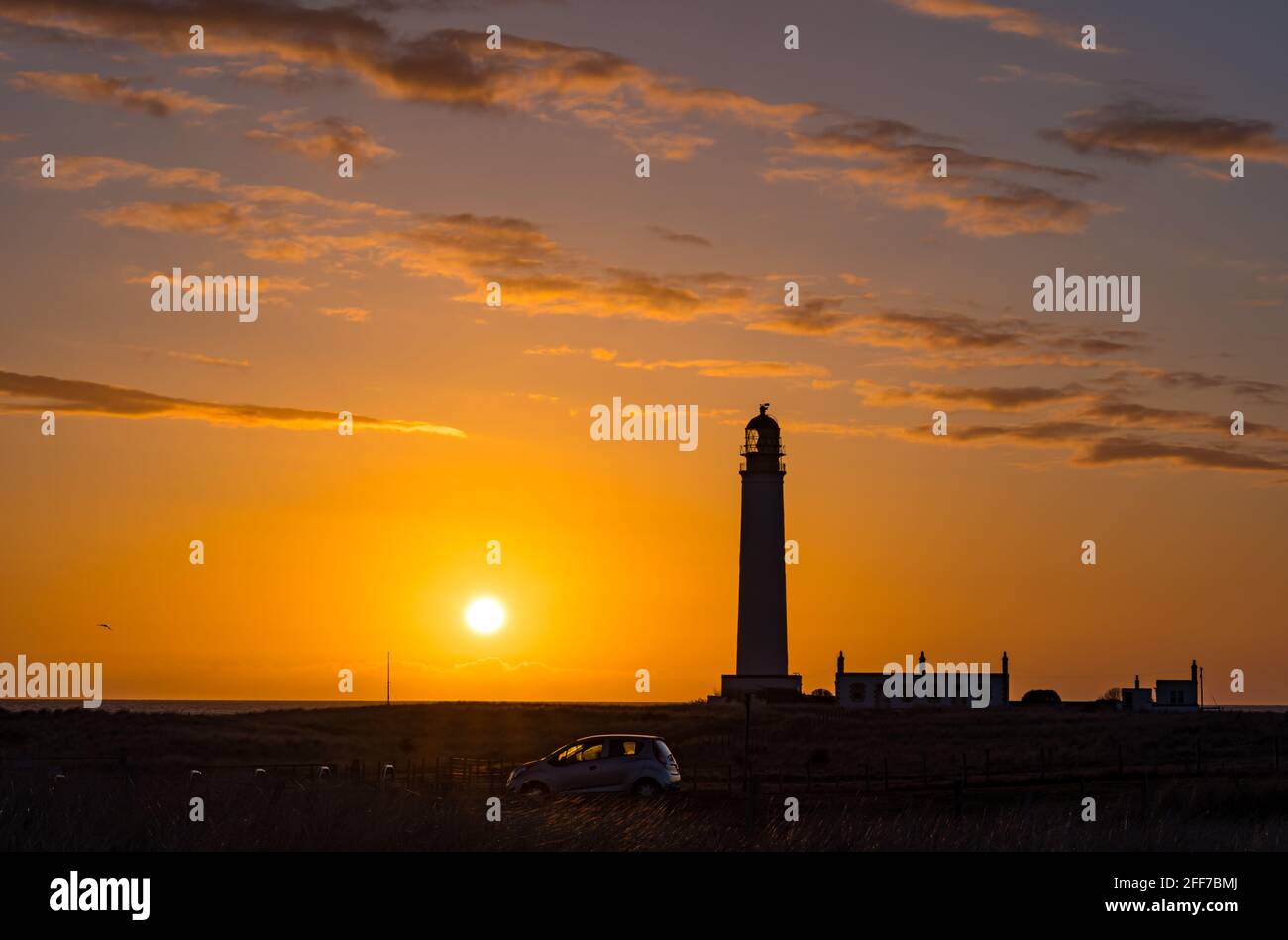 Barns Ness Lighthouse at dawn sunrise with a colourful sky, East Lothian, Scotland, UK Stock Photo