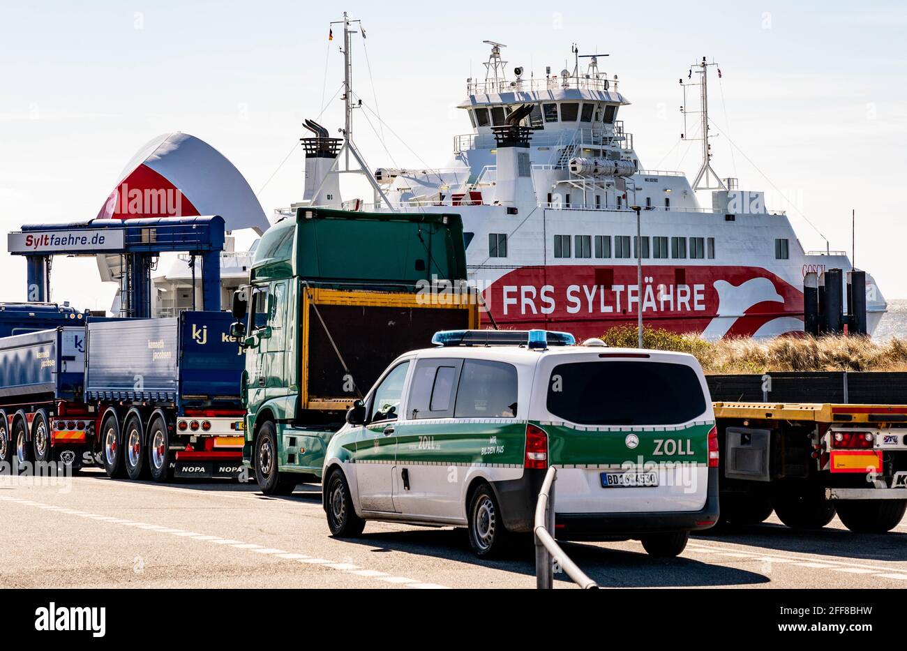 List Auf Sylt, Germany. 24th Apr, 2021. Vehicles wait at the harbour on the island of Sylt for the Sylt ferry. The municipality of Sylt will participate in the North Frisia Tourism Model Project. In four model regions in Schleswig-Holstein, tourism businesses are to test a gradual relaxation of corona protection measures. The model project on Sylt starts on 1 May and is initially scheduled to run until 31 May. Credit: Axel Heimken/dpa/Alamy Live News Stock Photo