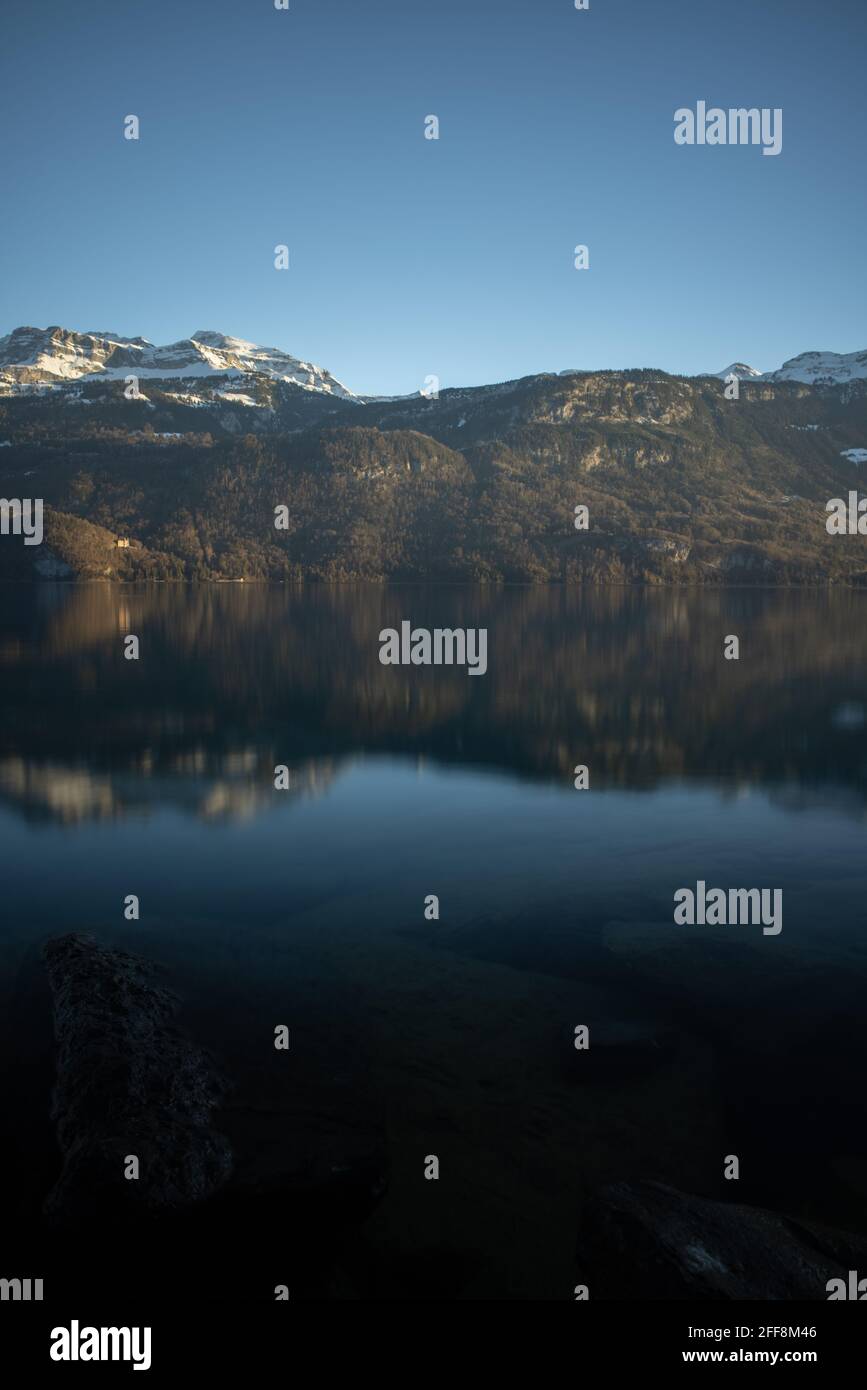 Scene of the tranquil lake by the picturesque hills Stock Photo - Alamy