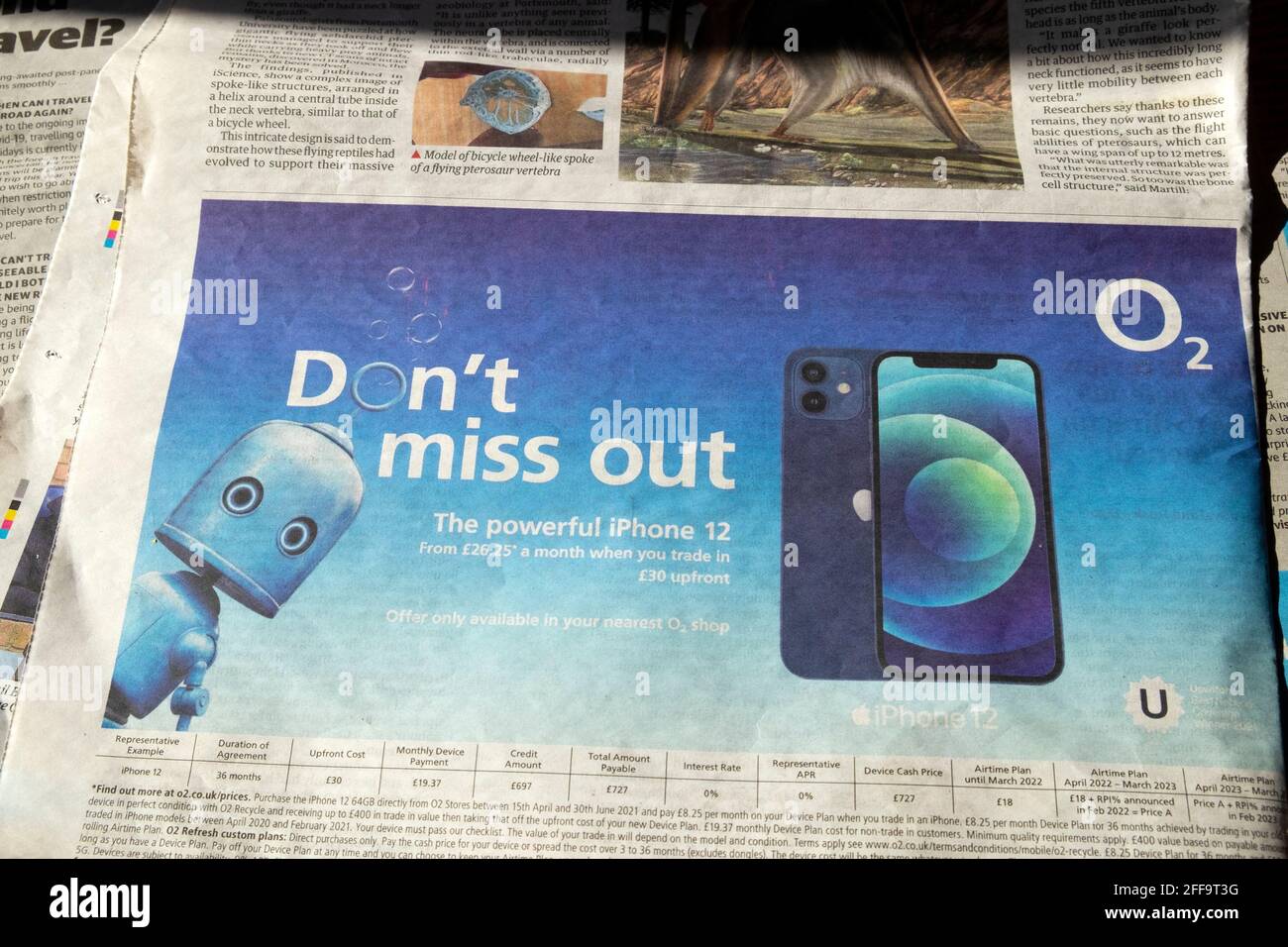 'Don't miss out' O2 newspaper advertisement advert with iPhone 12 24 April 2021 Stock Photo