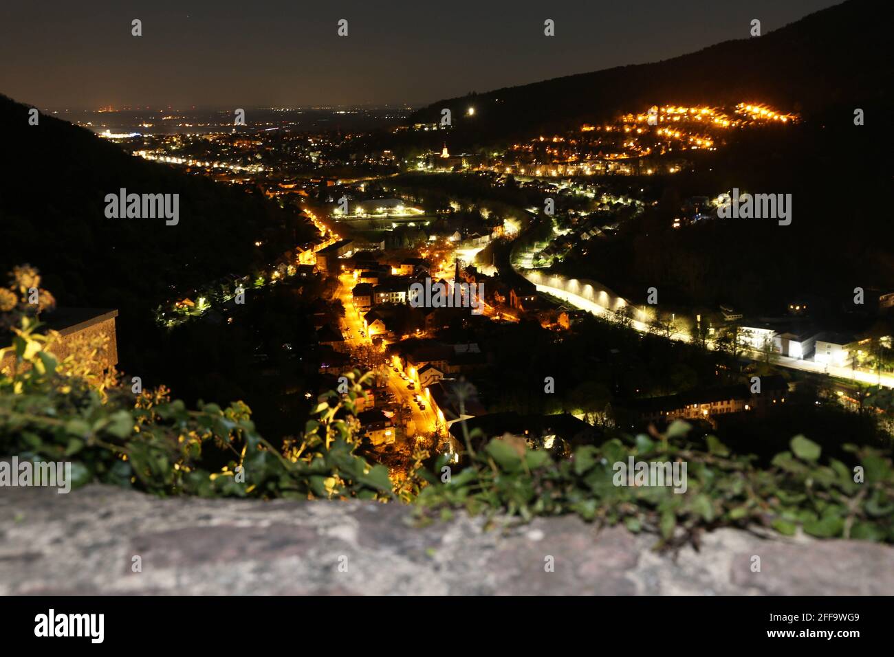 Night view of Neustadt an der Weinstrasse (Germany), photographed from the Wolfsburg above the town Stock Photo