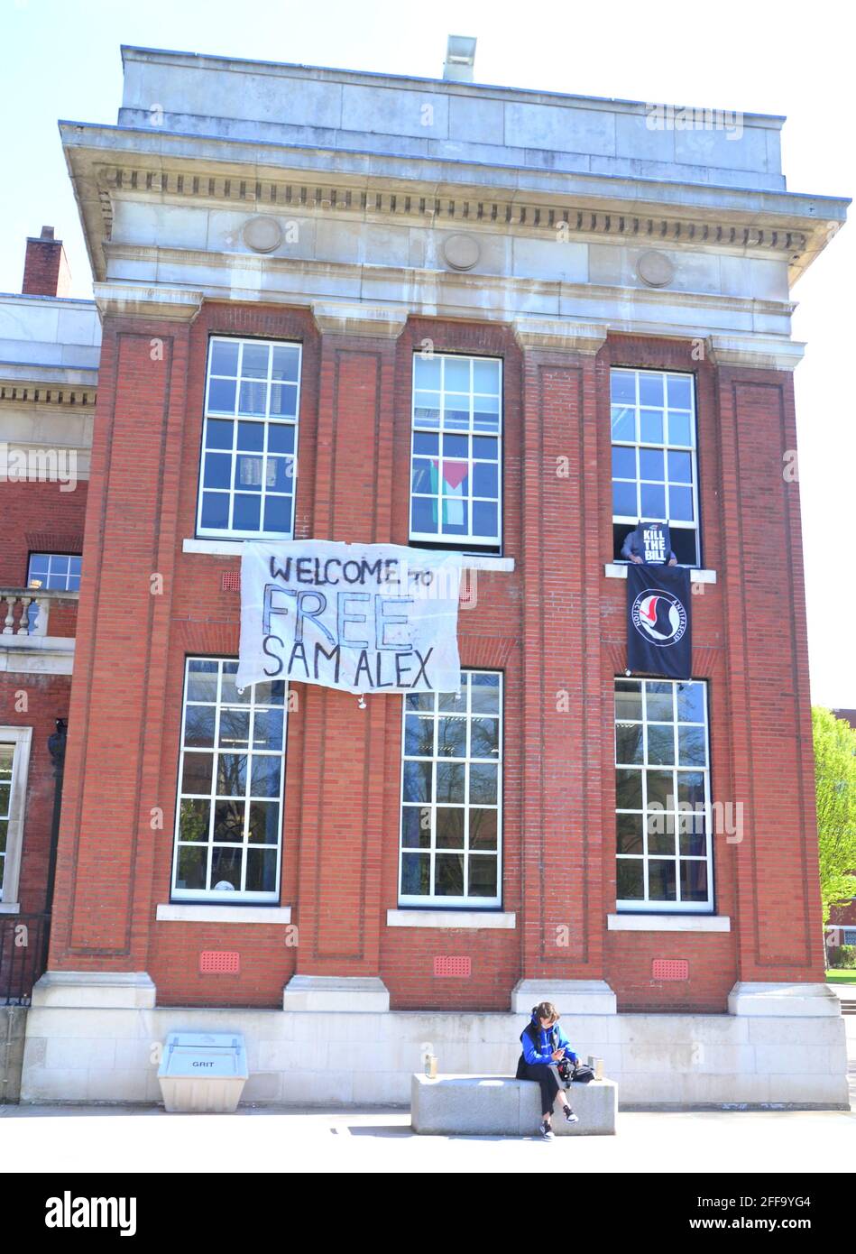 Pictured on April 24th, 2021, a banner students have hung from the Samuel Alexander building at the University of Manchester, Manchester, Greater Manchester, England, United kingdom. Students have occupied the Samuel Alexander building at the campus since April 22nd. Amongst other demands, they want a rent rebate for students, elections for the University's leadership, a cash rebate of £1,500 for students, the end to police patrols of some student halls and no staff redundancies. Stock Photo