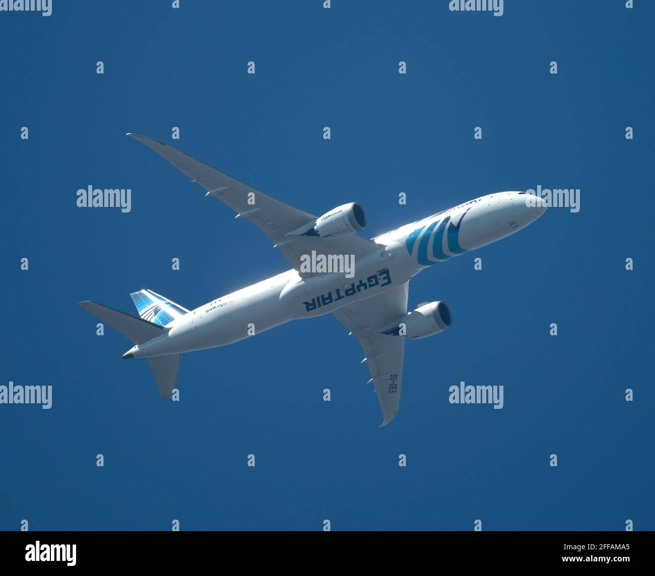 EgyptAir Boeing 787-9 Dreamliner leaves London Heathrow for Cairo on 24 April 2021 in blue sky Stock Photo