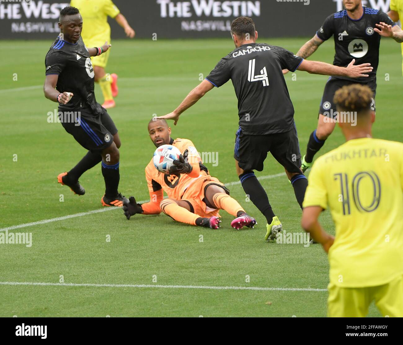 Nashville TN, USA. 24th Apr, 2021. CF MontrŽal goalkeeper Clement Diop (23) blocks the shot of Nashville SC midfielder Hany Mukhtar (10) during the first half of an MLS game between the FC Montreal and the Nashville SC at Nissan Stadium in Nashville TN. Credit: csm/Alamy Live News Stock Photo