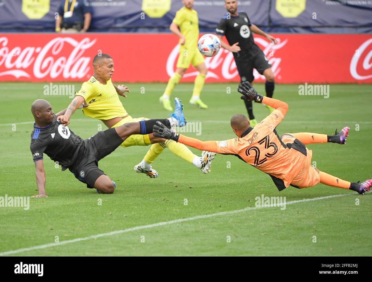 Nashville TN, USA. 24th Apr, 2021. CF MontrŽal defender Zachary Brault-Guillard (15) and CF MontrŽal goalkeeper Clement Diop (23) blocks the shot of Nashville SC forward Jhonder Cadiz (99) during the first half of an MLS game between the FC Montreal and the Nashville SC at Nissan Stadium in Nashville TN. Credit: csm/Alamy Live News Stock Photo