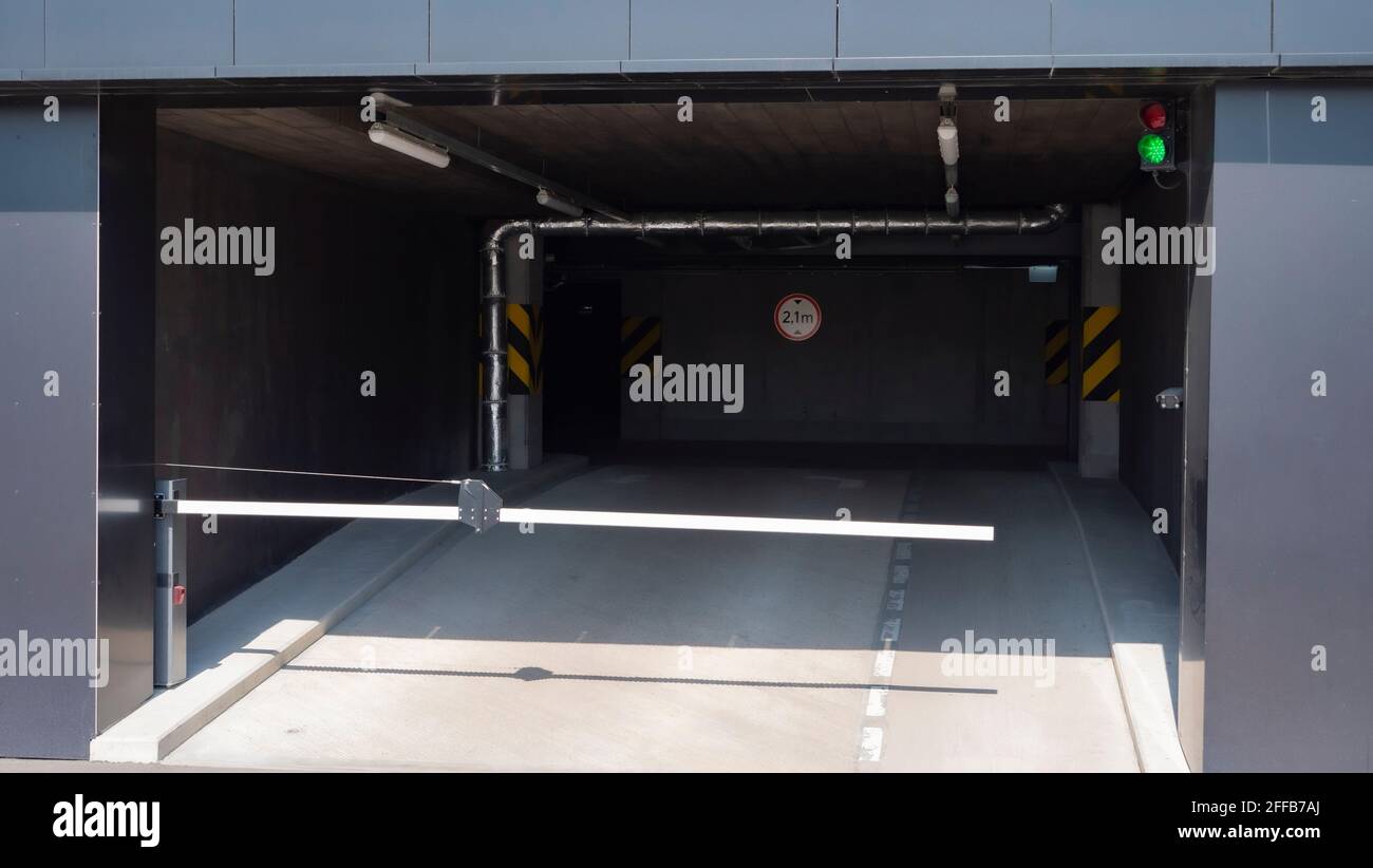Barrier to entry and exit of underground parking garage at sunny day Stock Photo