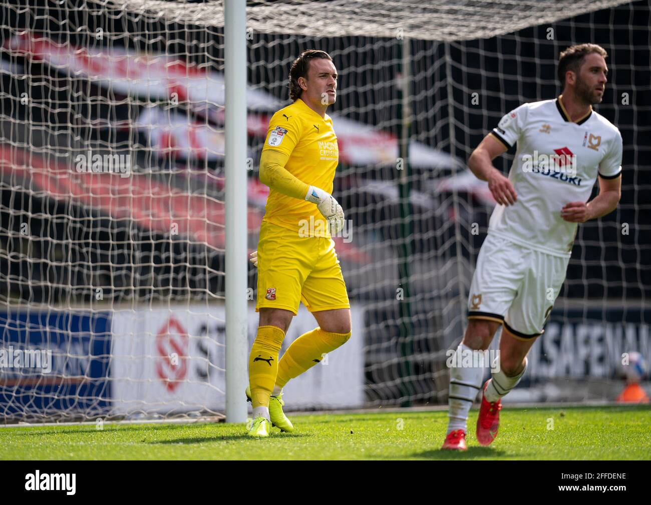 Milton Keynes, UK. 24th Apr, 2021. Goalkeeper Lee Camp of Swindon Town as Will Grigg (on loan from Sunderland) of MK Dons moves away during the Sky Bet League 1 behind closed doors match between MK Dons and Swindon Town at stadium:mk, Milton Keynes, England on 24 April 2021. Photo by Andy Rowland. Credit: PRiME Media Images/Alamy Live News Stock Photo