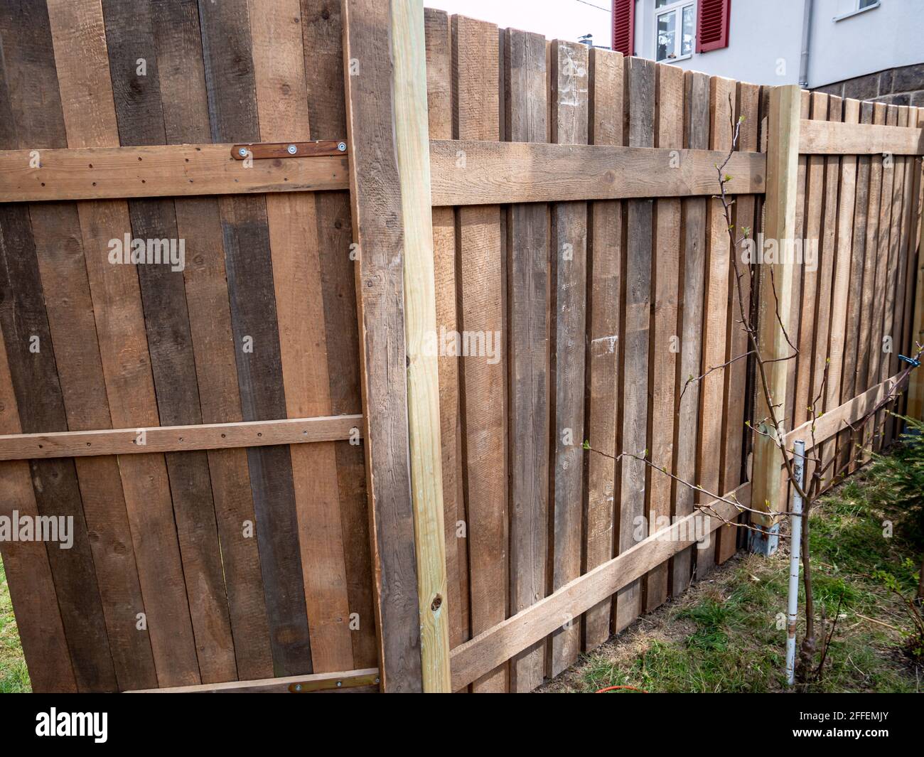New fence is being built in the garden Stock Photo