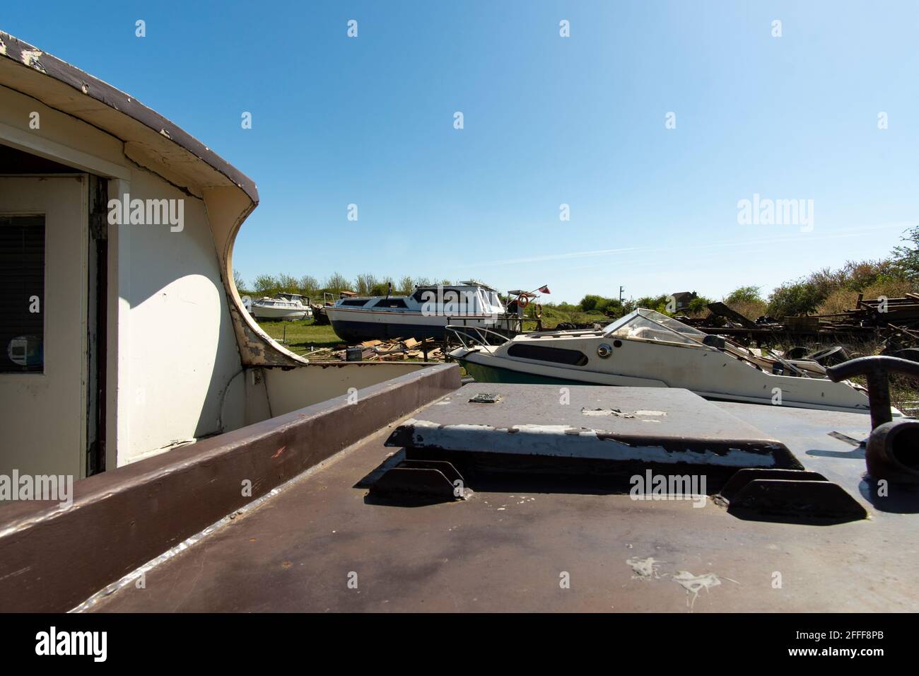 Old boats in a salvage yard Stock Photo Alamy