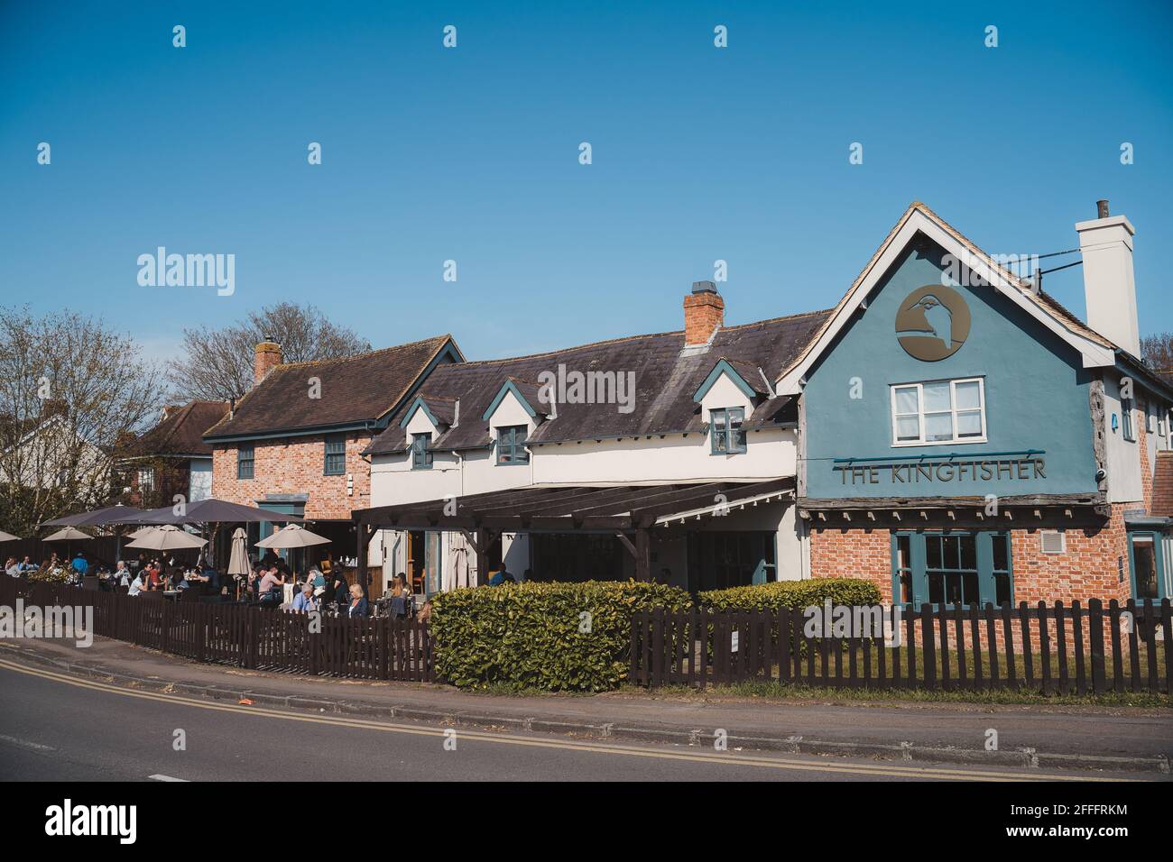 Staines-upon-Thames, Spelthorne  | UK -  2021.04.24: The Kingfisher pub restaurant open on warm Spring day in Chertsey Stock Photo