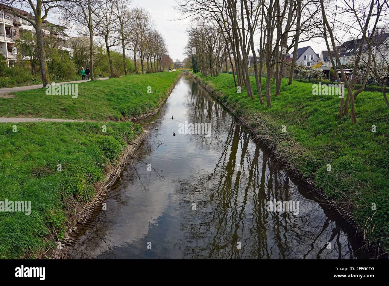 Unterrath, District in the North of Düsseldorf near the airport, the creek is called 'Kittelbach'  April 2021 Stock Photo