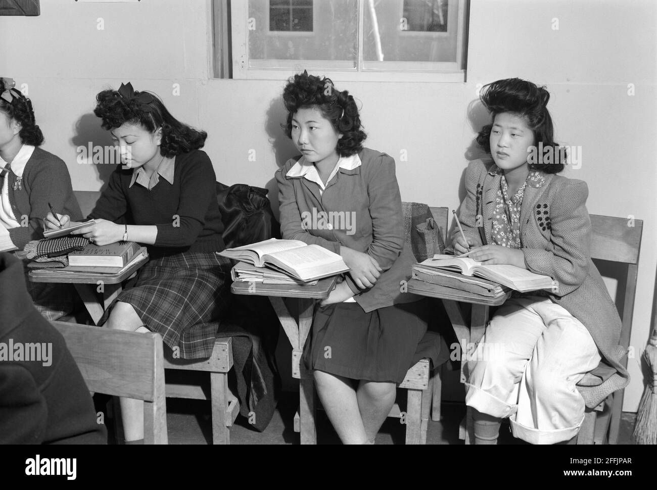 Kiyo Yoshida, Lillian Wakatsuki, Yoshiko Yamasaki, during High School Biology Class, Manzanar Relocation Center, California, USA, Ansel Adams, Manzanar War Relocation Center Collection, 1943 Stock Photo