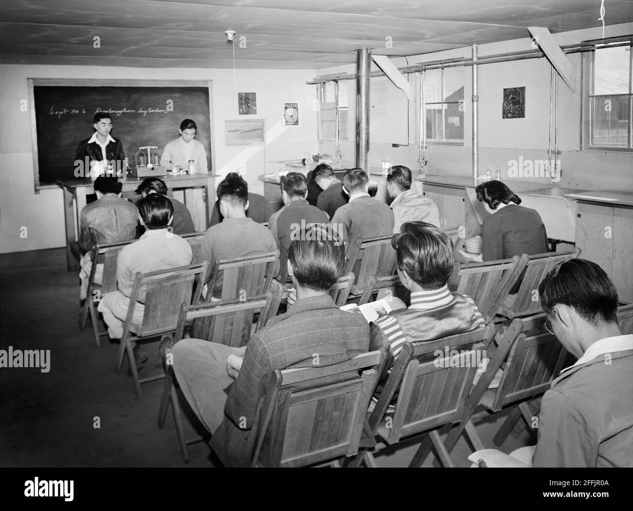Japanese-American Students sitting in Classroom Laboratory during Science Lecture, Manzanar Relocation Center, California, USA, Ansel Adams, Manzanar War Relocation Center Collection, 1943 Stock Photo