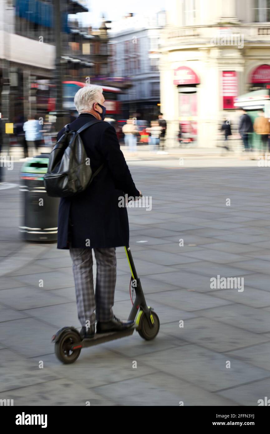 Electric scooter london man hires stock photography and images Alamy