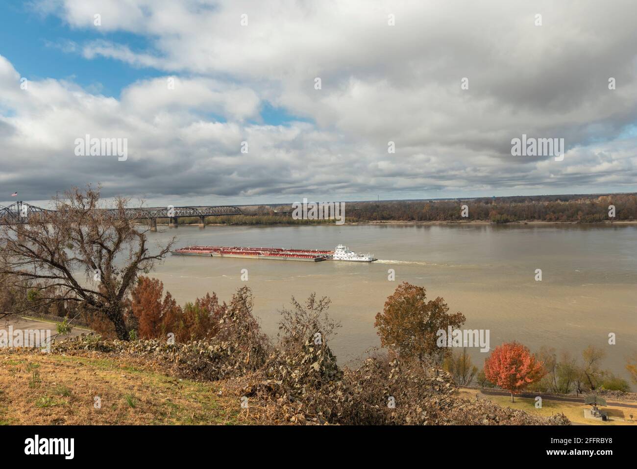 Mississippi River at Vicksburg has thousands of tons of grain past below it's bridges Stock Photo