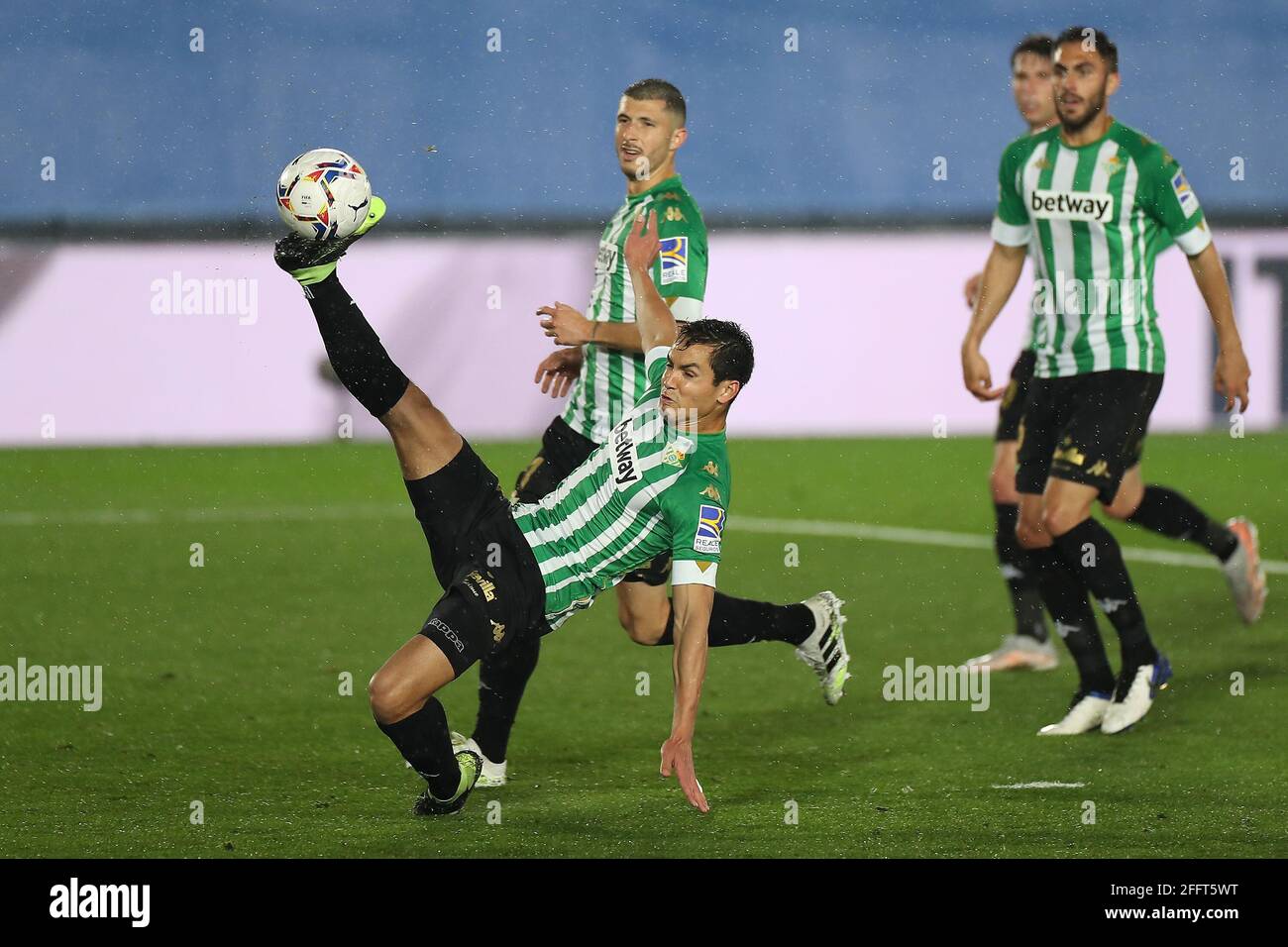 Madrid, Spain. 24th Apr, 2021. Real Betis' Aissa Mandi (front) competes during a Spanish league football match between Real Madrid and Real Betis in Madrid, Spain, on April 24, 2021. Credit: Edward F. Peters/Xinhua/Alamy Live News Stock Photo