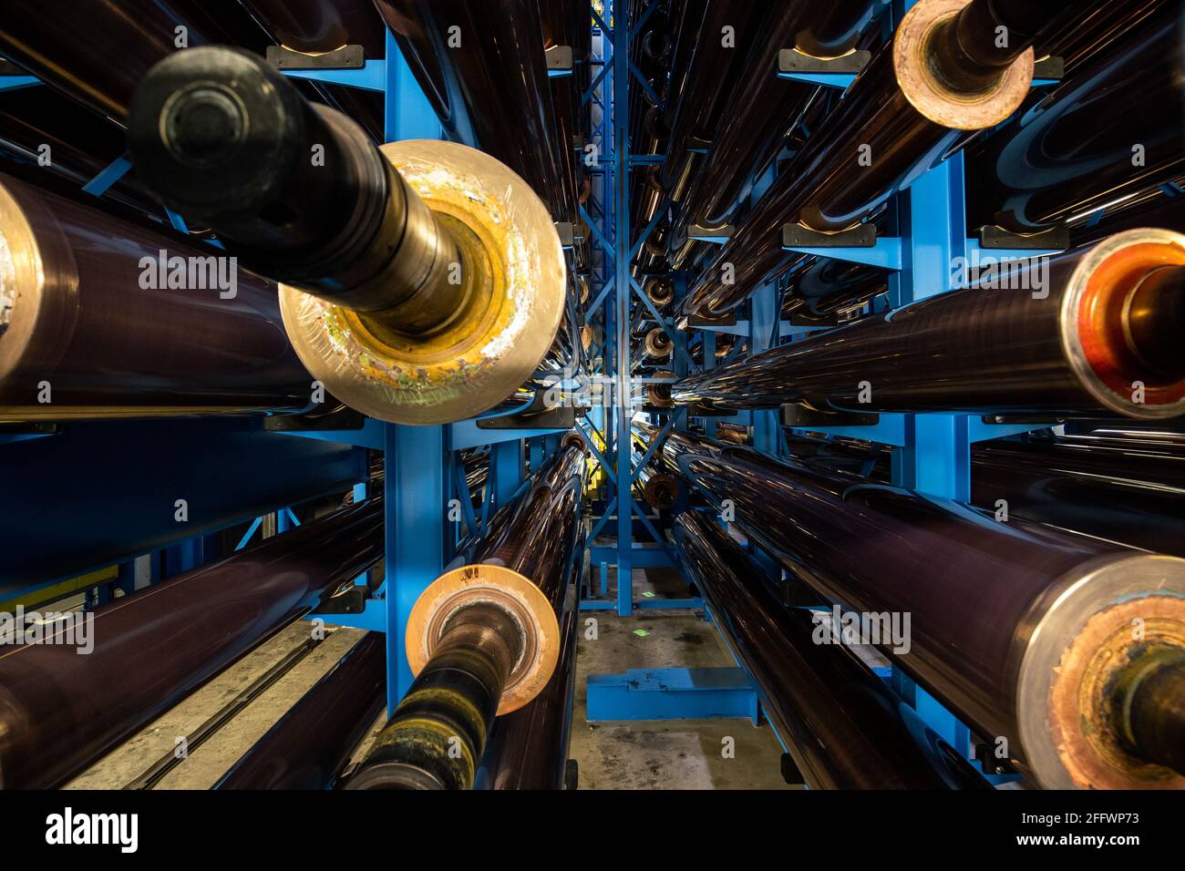 Nuremberg, Germany. 19th Apr, 2021. Copper-plated gravure cylinders lie on shelves in a warehouse at the Prinovis printing company. The Nuremberg-based large-scale printing plant of the Prinovis Group, which is part of the Bertelsmann Group, will close on April 30, 2021. Credit: Daniel Karmann/dpa/Alamy Live News Stock Photo