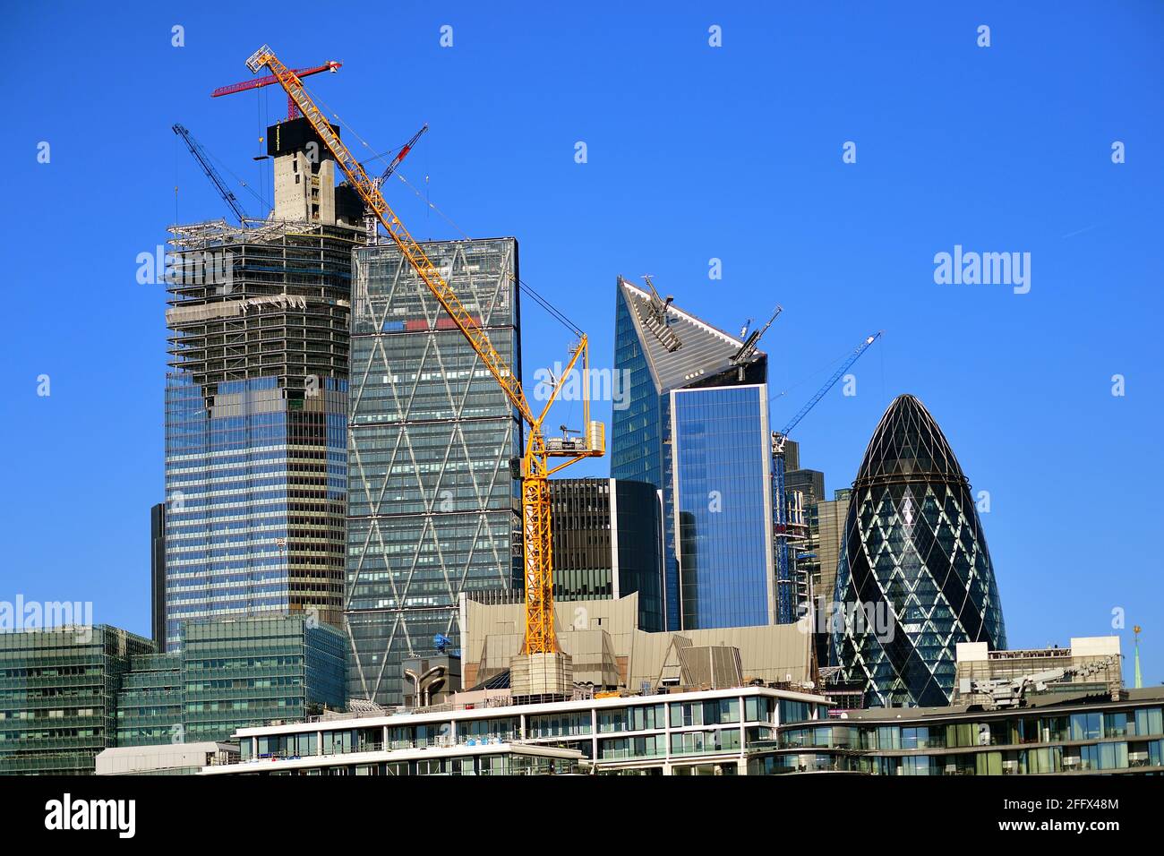 London, England, United Kingdom. The fast expanding skyline is rapidly apparent among the construction cranes in the City of London. Stock Photo