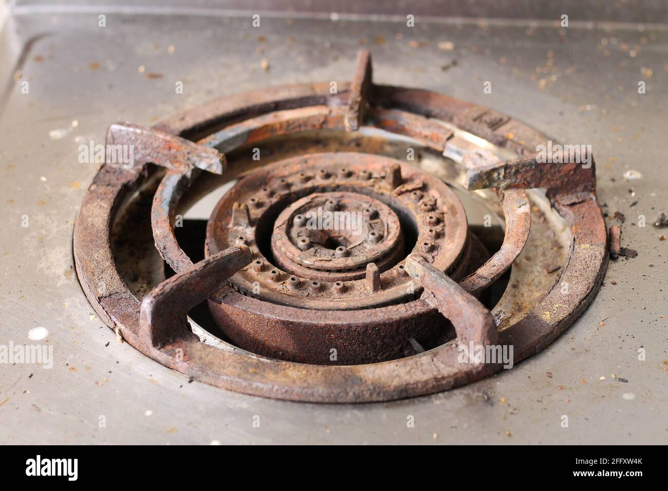 Old gas stove burners have rust. Because it is not cleaned Stock Photo