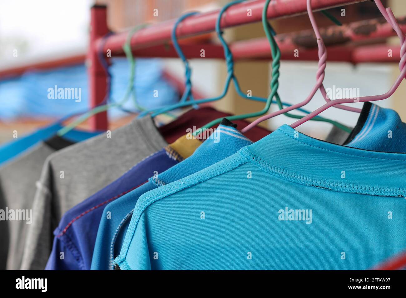 Dry clothes on hangers to dry on hot days. Stock Photo