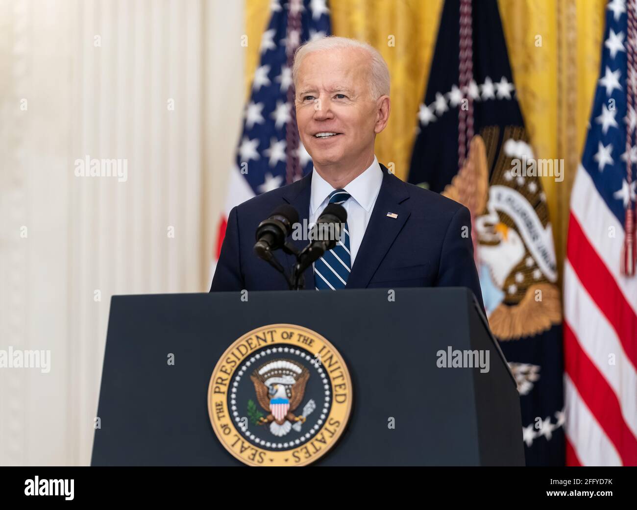 President Joe Biden smiles during his first official press conference Thursday, March 25, 2021, in the East Room of the White House. (Official White House Photo by Adam Schultz) Stock Photo