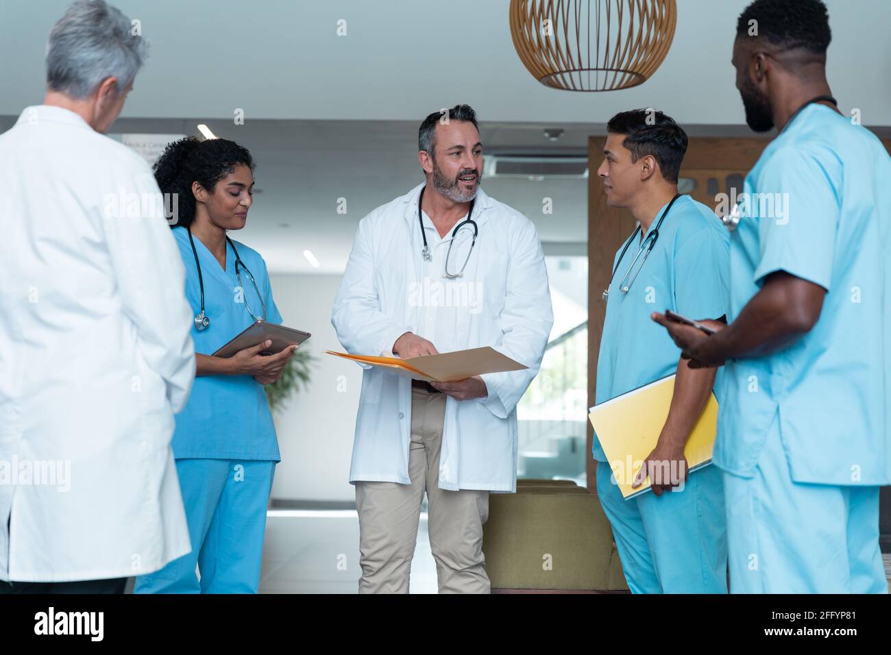 Diverse male female doctors standing hi-res stock photography and ...
