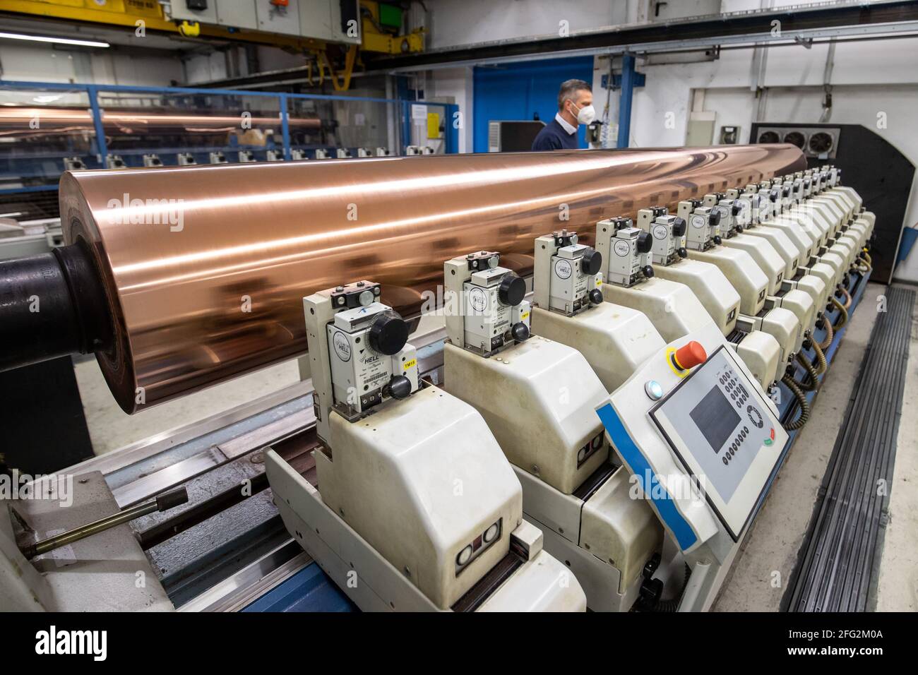 Nuremberg, Germany. 19th Apr, 2021. A copper-plated gravure cylinder lies on an engraving machine at the Prinovis printing plant. The Nuremberg-based large-scale printing plant of the Prinovis Group, which is part of the Bertelsmann Group, will close on April 30, 2021. Credit: Daniel Karmann/dpa/Alamy Live News Stock Photo