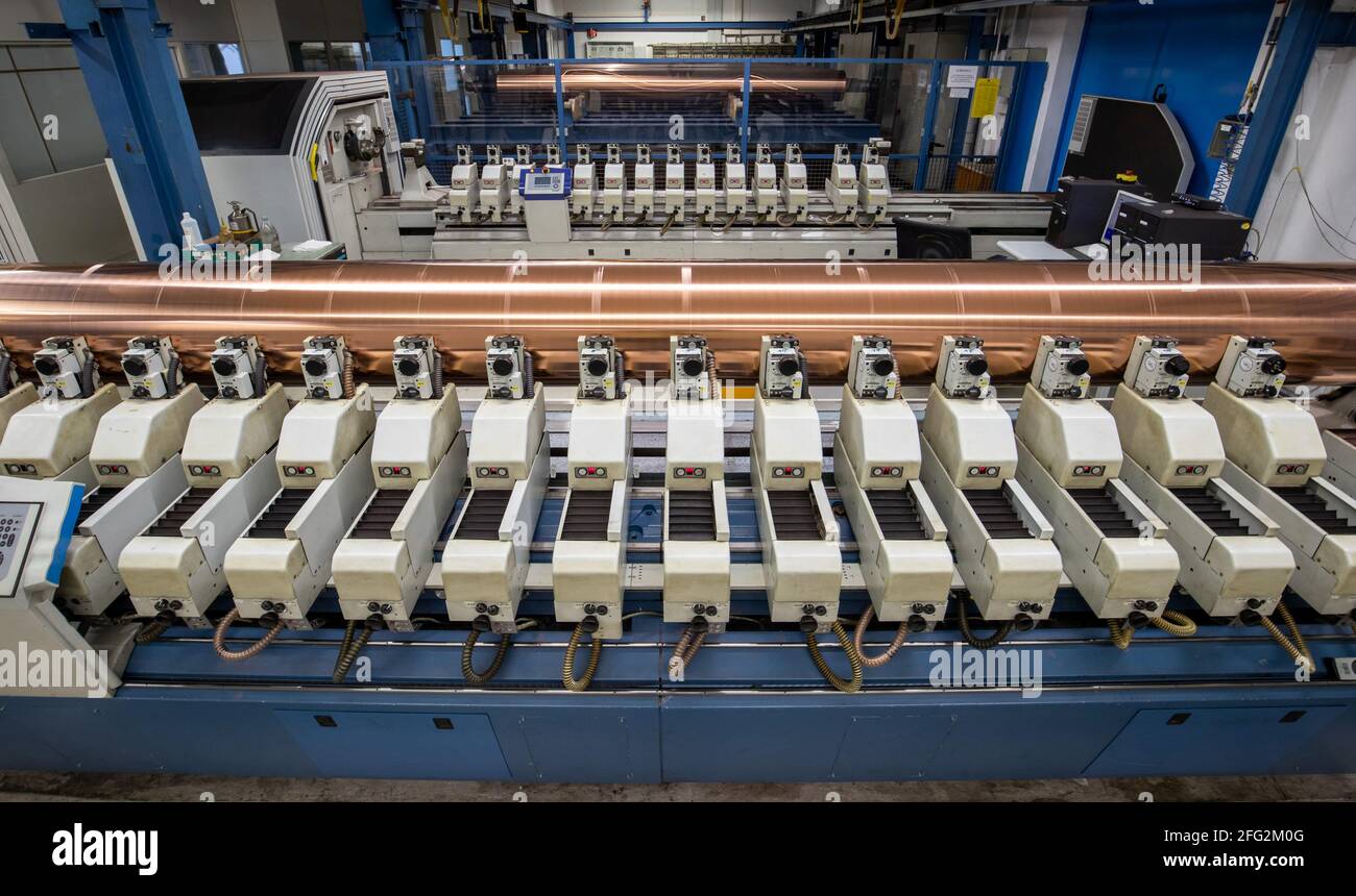 Nuremberg, Germany. 19th Apr, 2021. A rotating copper-plated gravure cylinder is engraved at the Prinovis printing plant. The Nuremberg-based large-scale printing plant of the Prinovis Group, which is part of the Bertelsmann Group, will close on April 30, 2021. Credit: Daniel Karmann/dpa/Alamy Live News Stock Photo