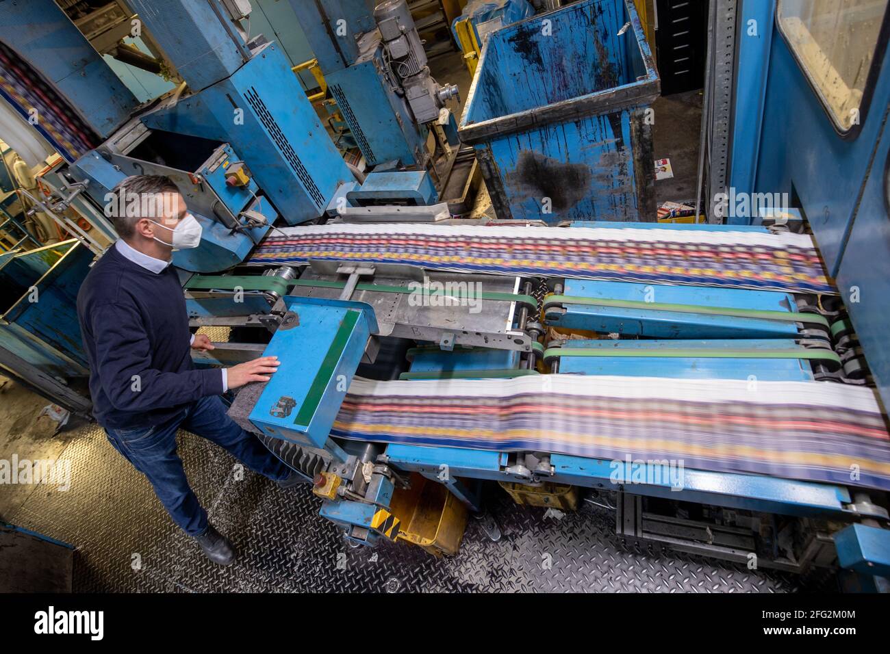 Nuremberg, Germany. 19th Apr, 2021. Printed sheets run down an assembly line at the Prinovis printing plant. The Nuremberg-based large-scale printing plant of the Prinovis Group, which is part of the Bertelsmann Group, will close on April 30, 2021. Credit: Daniel Karmann/dpa/Alamy Live News Stock Photo