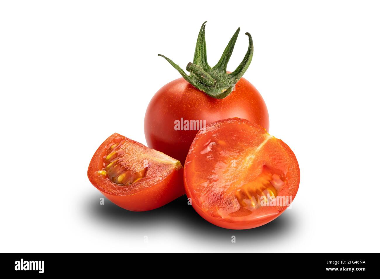 Side view of ripe a whole, a half and a piece of ripe cherry tomato on white background. Tomatoes or Solanum lycopersicum or lycopersicon esculentum a Stock Photo
