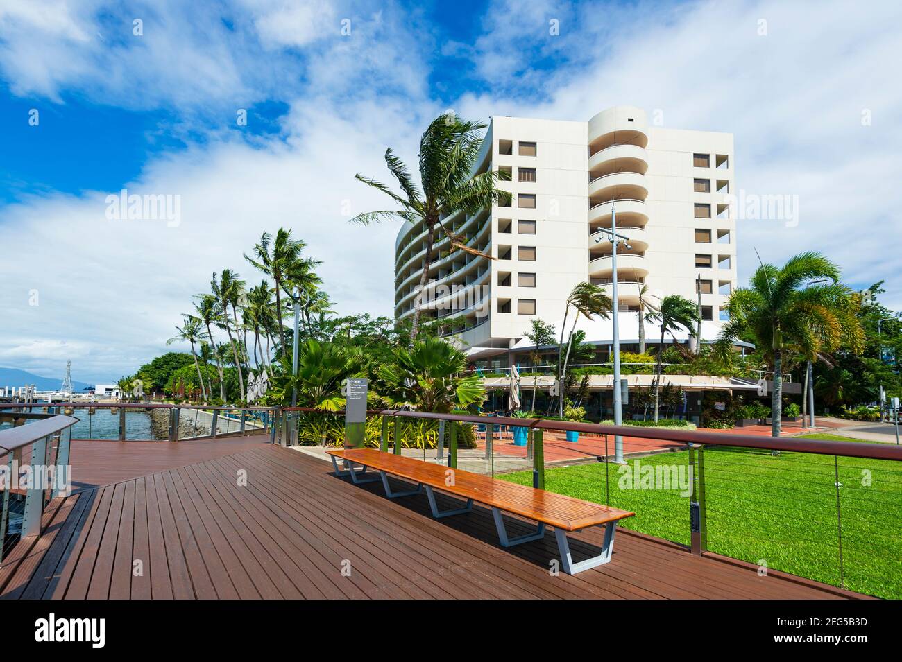 Modern white apartments building and boardwalk along Trinity Inlet foreshore, Cairns, Far North