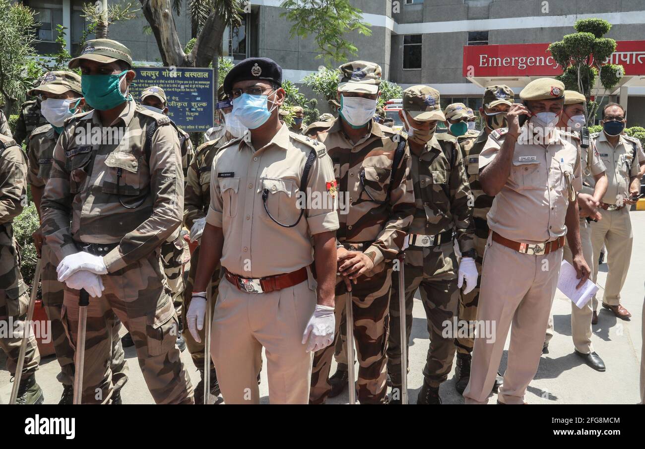 Indian security personnel and Delhi Police officers stand on guard