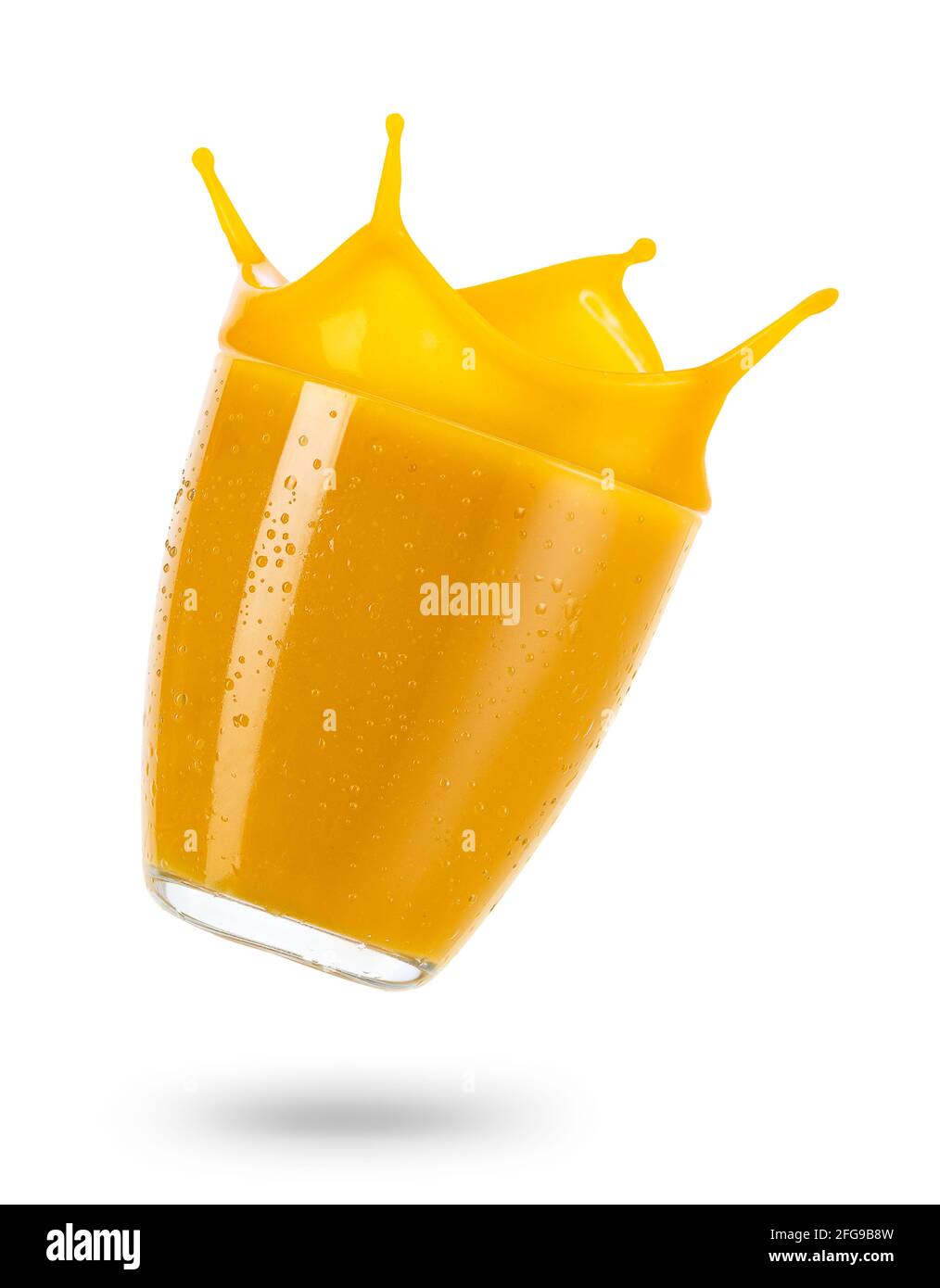 Falling Glass Of Mango Smoothie With Splash Isolated On White Stock