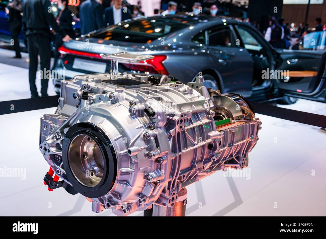 The electric motor from an Audi e-tron GT with an e-tron GT in the  background on display at the 2021 Shanghai Auto Show, China Stock Photo -  Alamy