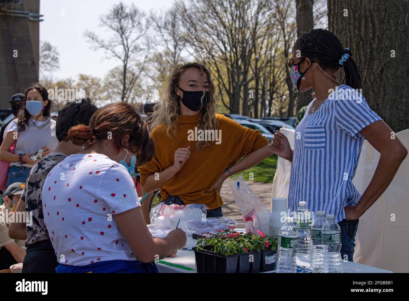 People water paint at the art table during an Earth Day Celebration in Astoria Park of the Queens borough of New York City.Congresswoman Ocasio-Cortez joined by New York State Senator Jessica Ramos and New York Assembly Member Zohran Mamdani for remarks about the NRG Energy, Inc proposal for the Astoria power plant. The Congresswoman opposes NRG's effort to replace their 50-year old turbine at the Astoria 'peaker' plant with a generator that burns fossil fuels extracted by fracking. (Photo by Ron Adar/SOPA Images/Sipa USA) Stock Photo