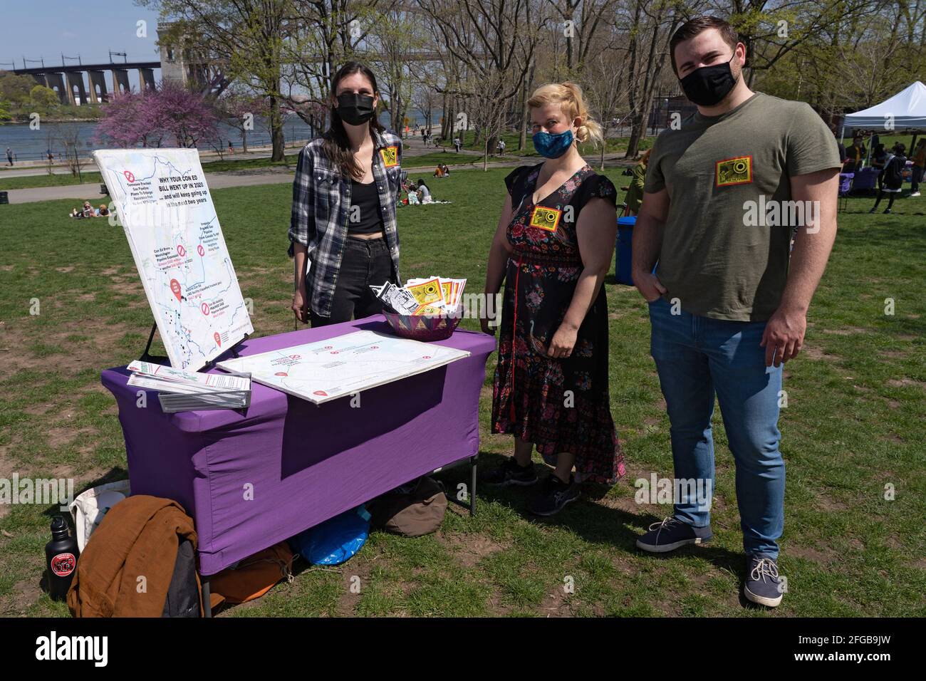 Activists stand by the Sane Energy Project table during Earth Day Celebration in Astoria Park of the Queens borough of New York City.Congresswoman Ocasio-Cortez joined by New York State Senator Jessica Ramos and New York Assembly Member Zohran Mamdani for remarks about the NRG Energy, Inc proposal for the Astoria power plant. The Congresswoman opposes NRG's effort to replace their 50-year old turbine at the Astoria 'peaker' plant with a generator that burns fossil fuels extracted by fracking. (Photo by Ron Adar/SOPA Images/Sipa USA) Stock Photo